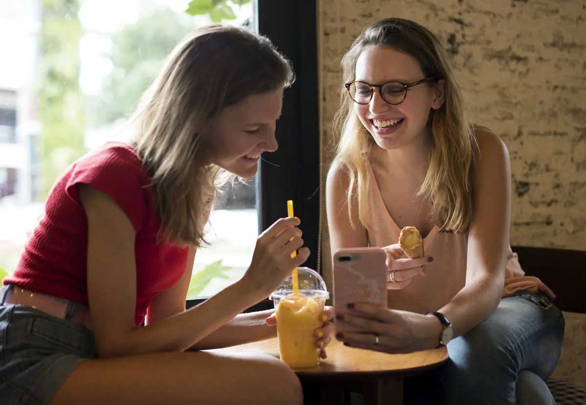 Two students enjoying a snack